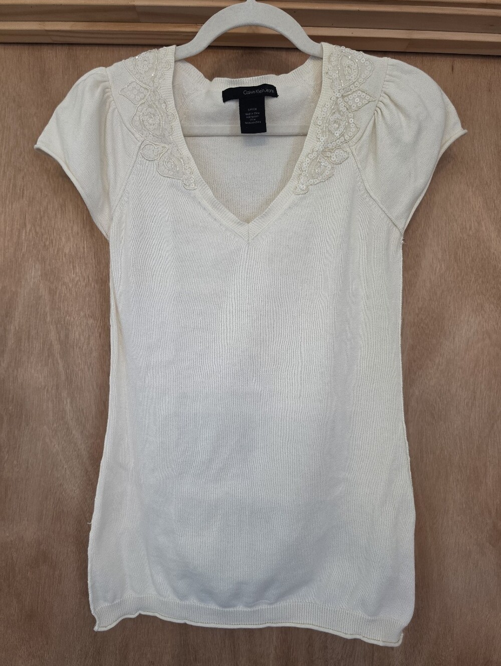 Calvin Klein Jeans Cream V‑Neck Short Sleeve Top with Embellished Trim